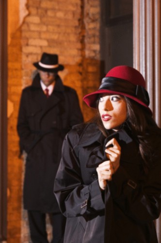 A woman being stalked in an alley