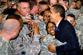 President Obama hugging military personnel.