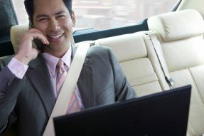 A businessman applying for a payday loan by phone.