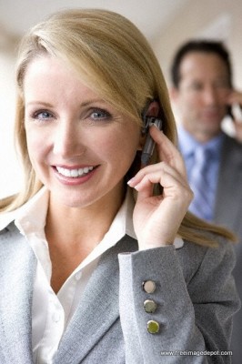 A business woman applying for a payday advance loan over the phone.