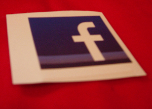 Close-up of a sticker bearing the Facebook logo.