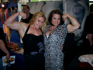 flex_muscles Two female weightlifters flex for the camera.