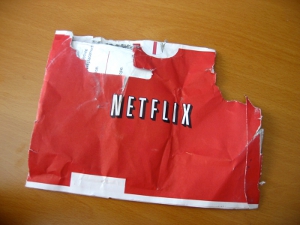 A chewed-up Netflix DVD mailer envelope.