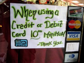 credit_card Retailer's sign advertising that a minimum credit card purchase is necessary for them to derive profit above the interchange fees they must pay card companies.