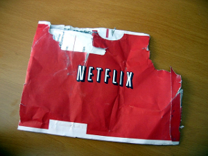 A red Netflix DVD envelope that has seen better days – it's torn and chewed.