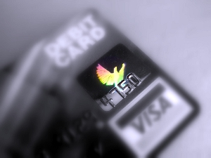 Artistic black-and-white close-up of a debit card, with colors altered in Picasa.