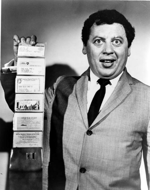 credit_cards Marty Allen, American comedian, holding wallet with six cards extended in accordion fashion. Visible from top to bottom are "Diner's Club", "Hilton", "American Express", and "Biltmore/Barkley" credit cards; Social Security card, and "American Federation of Television and Radio Artists" union card.