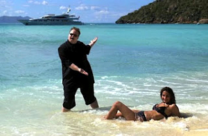 A heavyset man and a fit woman in a bikini meet on a tropical beach. A cruise ship is visible in the background.