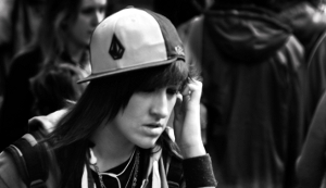 Black-and-white photo of an emo teenage girl talking on the phone.