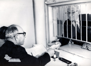 Vintage photo of a transaction at an Israeli tax office.