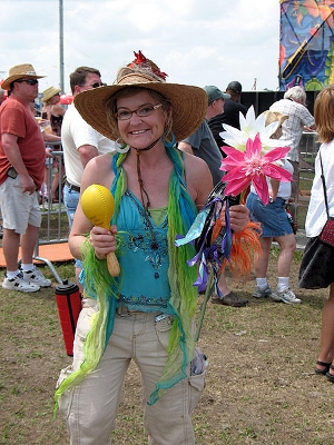 A middle-aged woman is happy to enjoy the spoils of a trip to a craft festival.