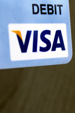 prepaid_debit Close-up of the logo corner on a Visa debit card.