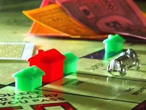 housesitting Close-up of homes on a Monopoly board.