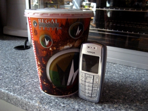 big_soda_ban A large-sized movie theater soda, set next to a cell phone to offer a size comparison.