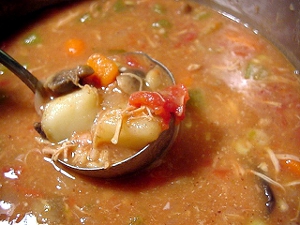 Huge pot of soup made from turkey leftovers, chicken stock, potatoes, celery, carrots, baby limas, mushrooms, onions, tomatoes and one green pepper, minced garlic cloves, milled flax seed and a cup of pearl barley.