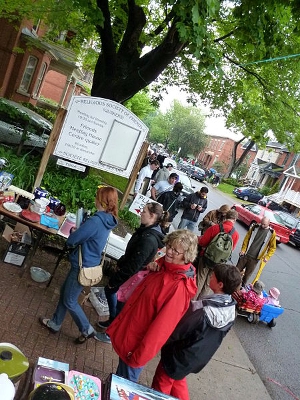 A community garage sale, held outside a church.