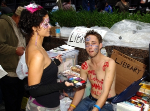 prime_working_years Occupy Wall Street demonstrators taking time out to paint each other's faces.