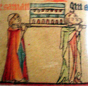 Fragment of an ancient Icelandic tapestry depicting two men carrying a funeral casket.