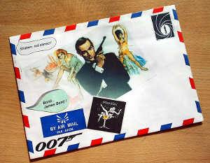 survive_being_shot Artist's rendition of Sean Connery as James Bond and two “Bond Girls,” printed on an envelope.