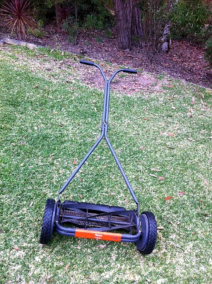 using_antiquated_tools A push lawnmower.
