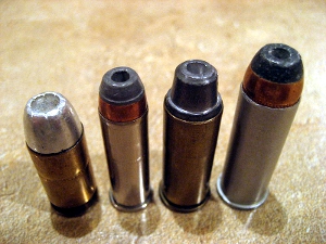 Four hollow point bullets, displayed side by side.