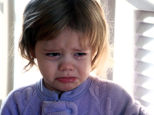 A weeping toddler girl.