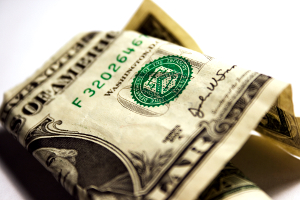 Close-up of a folded over dollar bill.
