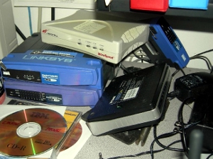 A stack of routers and other Internet-related devices.