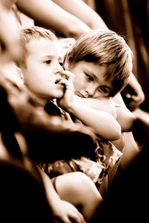 Sepia photo of bored boys at Little Penang Street Market in Myanmar.