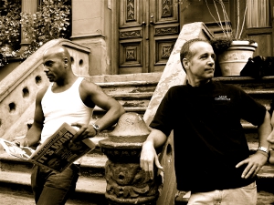 Sepia photo of neighbors on their front walk in Harlem, N.Y.