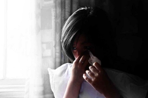 A crying young woman.