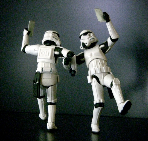 Two Star Wars Stormtrooper actions figures posed, dancing arm-in-arm.